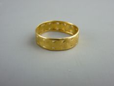 A TWENTY TWO CARAT GOLD WEDDING BAND with pierced heart shaped decoration, 2.4 grms, size 'O'