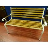 A FULLY RESTORED GARDEN BENCH with slatted seat and back on cast iron ends, 83.5 cms high, 123 cms