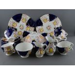 TWENTY NINE PIECES OF GAUDY WELSH 'TULIP' TEAWARE to include a muffin dish and cover, two sandwich