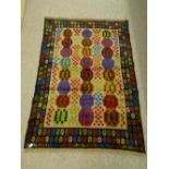 A CONTEMPORARY BALUCHI RUG with colourful block pattern central panel and wide border, 178 x 126