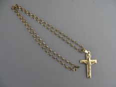 A NINE CARAT GOLD LINK CHAIN with crucifix, 4.8 grms