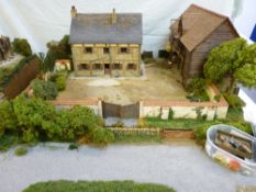 A SUPERB 1/32nd SCALE SCRATCH BUILT MODEL OF A FRENCH FARMHOUSE and side barn within a wall