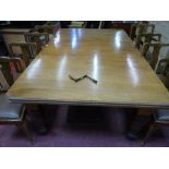 A SUBSTANTIAL EDWARDIAN MAHOGANY WIND-OUT DINING TABLE with three additional leaves on turned corner