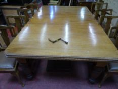 A SUBSTANTIAL EDWARDIAN MAHOGANY WIND-OUT DINING TABLE with three additional leaves on turned corner