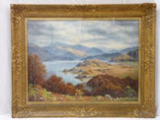 FREDERICK E ROBERTSON oil on canvas in a heavy gilt frame - tree covered lake side view with two