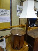 A VINTAGE OAK STANDARD LAMP & SHADE and an Arts & Crafts style octagonal top oak table, 39.5 cms