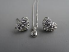 A PAIR OF SWAROVSKI HEART SHAPED EARRINGS, clustered overall with tiny czs and a fine link silver
