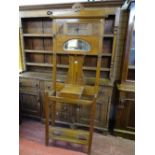 A POLISHED ART NOUVEAU STYLE HALLSTAND with lidded box and oval mirror, 207 cms high, 73 cms wide