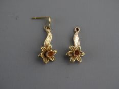 A PAIR OF NINE CARAT CLOGAU GOLD DAFFODIL EARRINGS, 2.2 grms