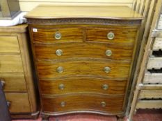 A REGENCY STYLE MAHOGANY SERPENTINE FRONTED CHEST of two short over four long drawers, 114 cms high,