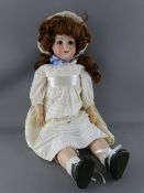 A KOPPELSDORF GERMANY BISQUE HEADED DOLL, no. 250.4, blue eyes, open mouth with teeth showing and