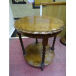 A BARLEY TWIST OAK SIDE TABLE with piecrust top and circular under tier shelf, 74 cms high, 63 cms