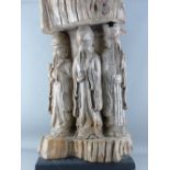 A LARGE JAPANESE WOOD CARVING depicting three sage or sennin, inset carved in relief, the top,