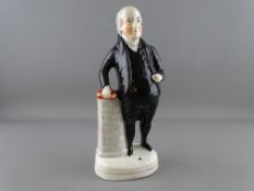A STAFFORDSHIRE POTTERY FIGURE OF JOHN BRYAN, 26 cms high (crazing, hairline down one side of the