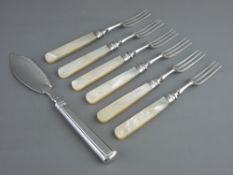 A SILVER BUTTER KNIFE and six mother of pearl handled dessert forks with silver ferrules, London