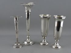 FOUR SILVER BUD VASES including a near pair and one other with Birmingham hallmarks and a floral