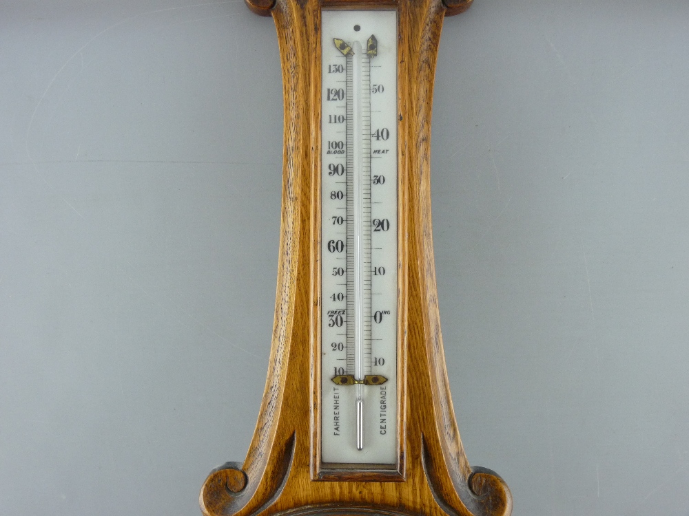 A CARVED OAK BANJO WALL BAROMETER with thermometer, 82 cms long - Image 2 of 4