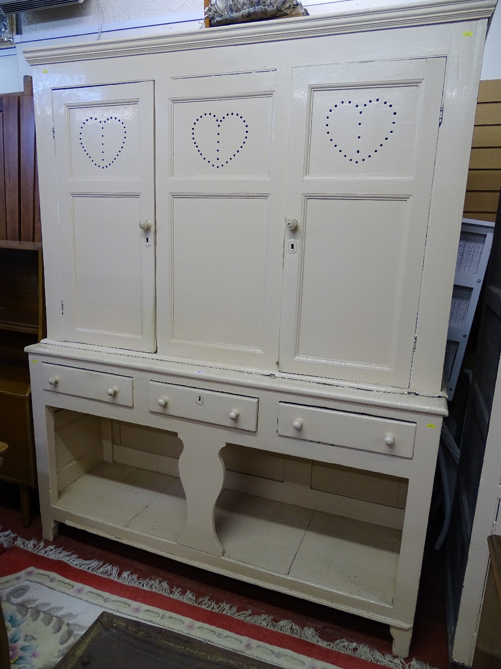 AN INTERESTING CREAM PAINTED PINE HOUSEKEEPER'S CUPBOARD, the upper section having two panelled