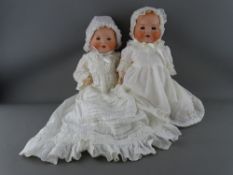 TWO ARMAND MARSEILLE GERMAN BISQUE HEADED BABY DOLLS, both marked to the back 'A M 351.14.K', blue