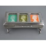 A SILVER TROUGH FORM TRIPLE STAMP HOLDER, late Victorian (marks rubbed, soldered repairs to feet),