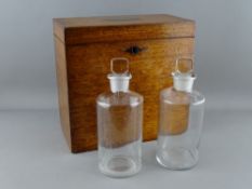 A GEORGIAN MAHOGANY TWO BOTTLE TRAVELLING DECANTER BOX having a lined and padded interior and two