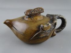 A CHINESE YIXING TYPE TEAPOT, the lid having a Cicada Beetle knop, 14 cms long