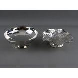 TWO SMALL SILVER BOWLS including a pierced example, 14.5 cms diameter, Sheffield 1955 and one