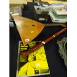 A vintage balalaika instrument, a Hohner concert tenor recorder & two balalaika manuals