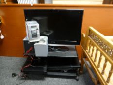 A Samsung flatscreen 37-inch TV, a Phillips stereo etc