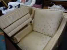 A pair of upholstered deep armchairs together with a matching foot stool (matching previous lot)