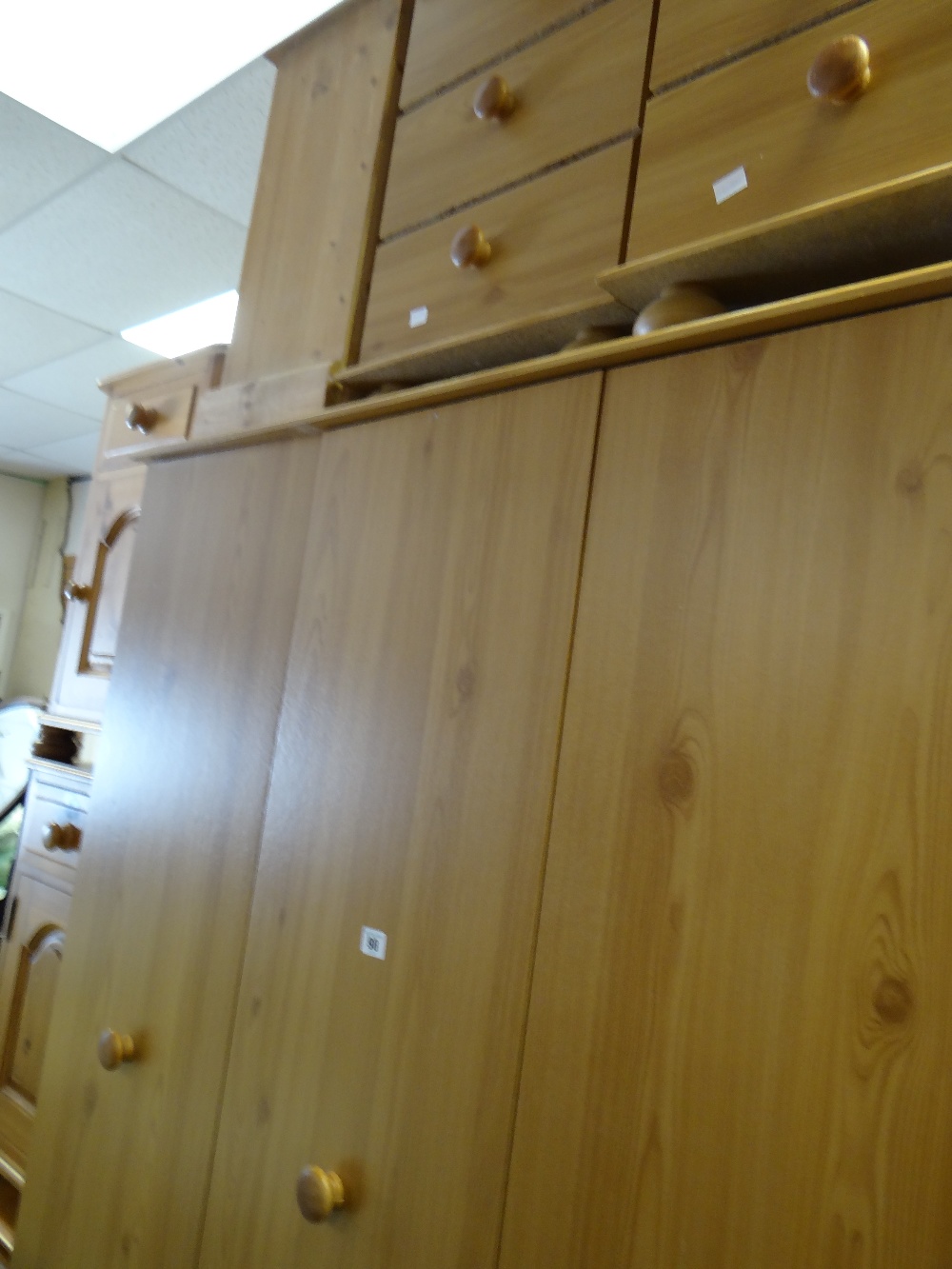 A modern wardrobe & matching pair of bedside cabinets, a pine three-drawer chest, a pair of pine