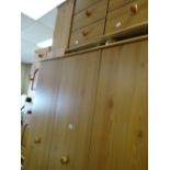 A modern wardrobe & matching pair of bedside cabinets, a pine three-drawer chest, a pair of pine