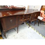 A serpentine front sideboard (distressed)