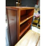 An modern Oriental hardwood open bookcase & a mid-century oak kitchen unit