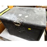 An antique metal coal box