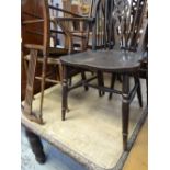 An antique carved dining table & sundry chairs