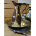 An EPNS footed tray, large brass ornamental charger, pair of candlesticks & copper jug