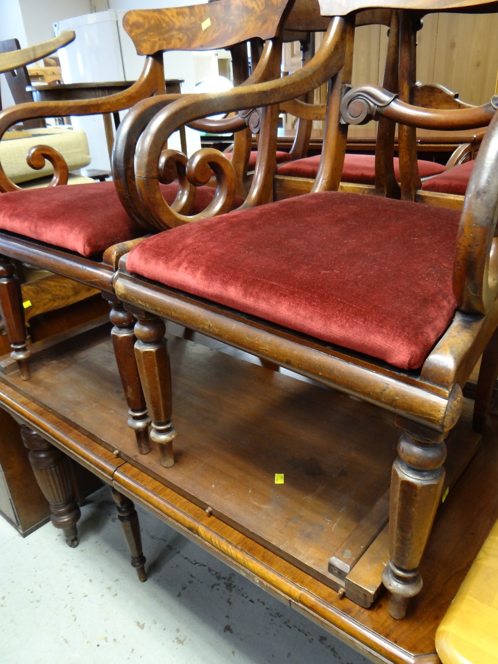 An antique extending walnut dining table & a set of eight railback chairs