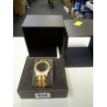 A Gucci diamond decorated yellow metal watch with box & papers
