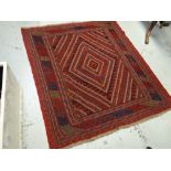 A blue & red patterned Gazak rug, 133 x 120cms