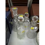 Four various good quality cut glass decanters