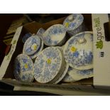 A box of blue & white plates, cups, muffin dish etc