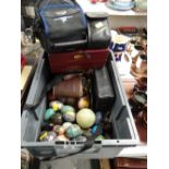 A box of ornamental mineral eggs & sundry camera equipment