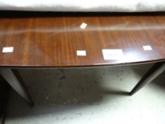 An antique mahogany foldover tea table