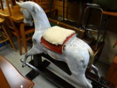 A vintage rocking horse with accessories (separated from stand)