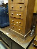 A vintage oak Wellington-type seven-drawer chest & a vintage sideboard