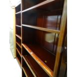 A pair of modern Oriental hardwood tall open bookcases