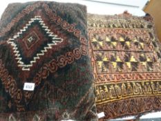 A pair of Persian woollen cushions