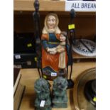 A wooden carved figure of St Anne together with two metal African tribal figures & a pair of green