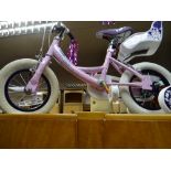 A pink infants practice bicycle with stabilisers (as new)